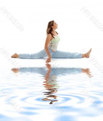 hanumanasana monkey pose on white sand