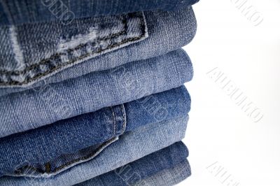 stask of blue jeans