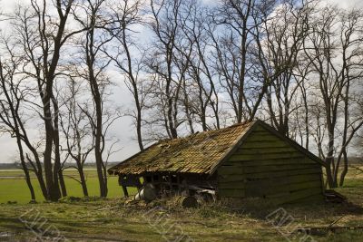 broken farmhouse in landscape