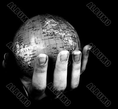 Globe in a girl`s hands