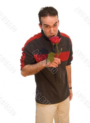 Man Smelling a Rose