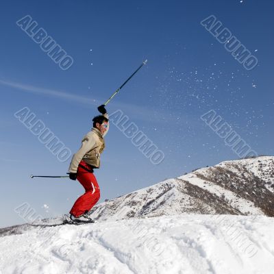Snow Skier jumping over blue sky