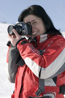 Attractive woman holding a camera