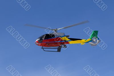 Red Helicopter with team over blue sky