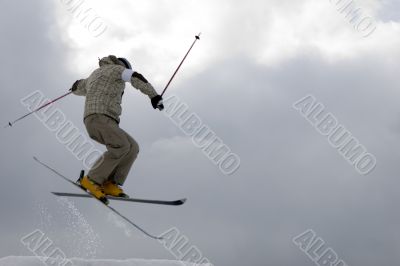 Freestyle. Snow Skier Jumping over sky.