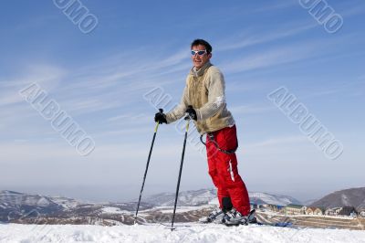 Snow Skier Jumping Against Blue Sky