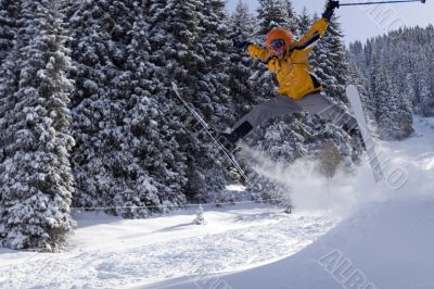 Snow Skier Jumping in winter forest
