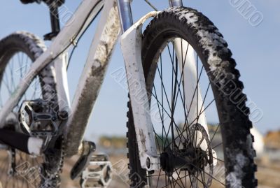Bike in winter over blue sky