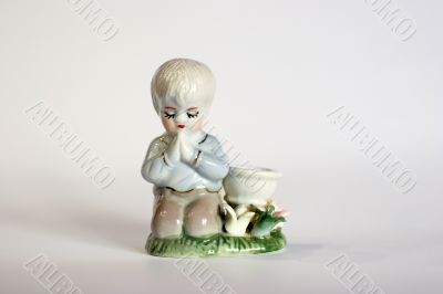 ceramic figurine of boy