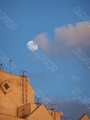 Moon, sky, clouds, and roof.