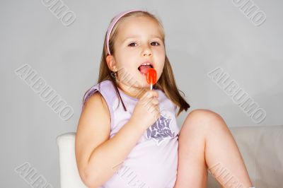 Nice young girl in pink on light background