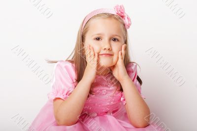 Nice young girl in pink on light background