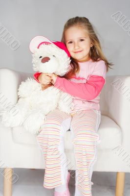 Nice young girl in pink on light background