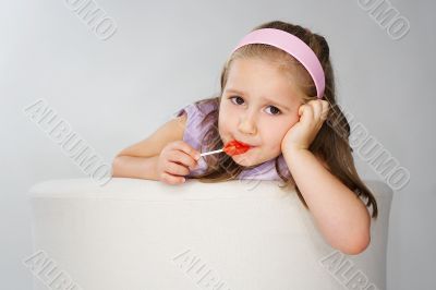 Nice young girl in pink on light background