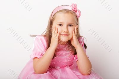 Nice young girl in pink on light background