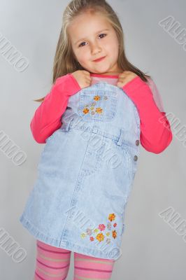 Nice young girl in pink on light background