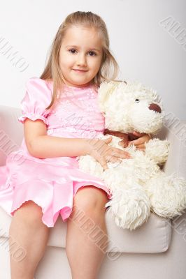Nice young girl in pink on light background