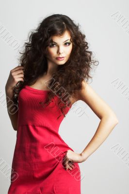 Brunette girl in red dress in red