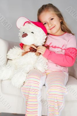 Nice young girl in pink on light background
