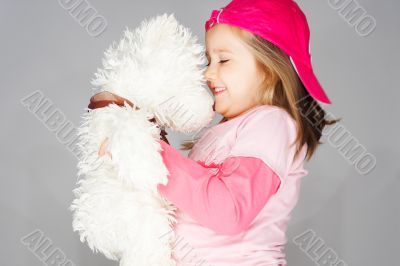 Nice young girl in pink on light background