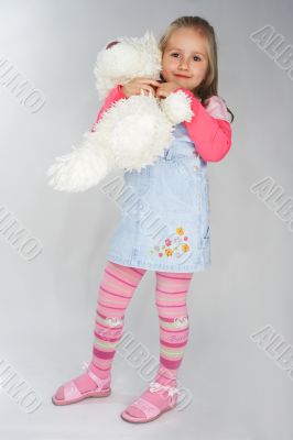 Nice young girl in pink on light background