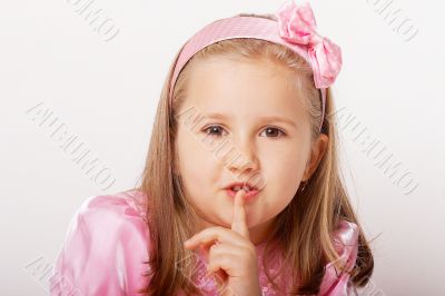 Nice young girl in pink on light background