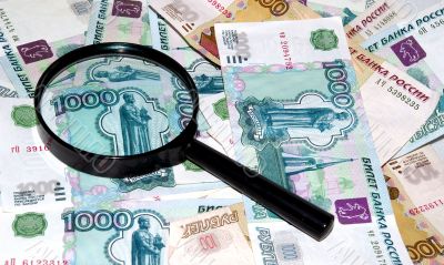 The Money and magnifying glass.