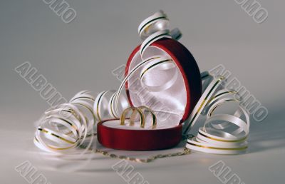 Close up of wedding bands over gold background
