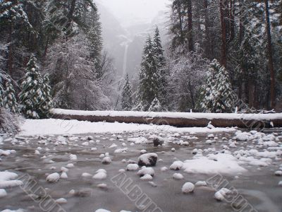 Waterfall in fog and snow. Yosemity park