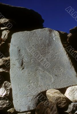 Mani stones with Buddhist figures