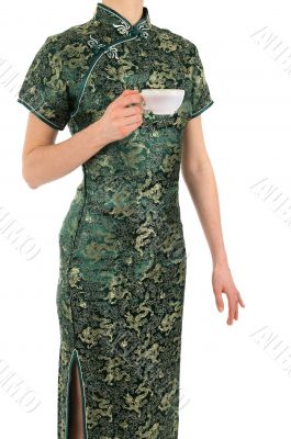Woman in Chinese dress with a cup of tea