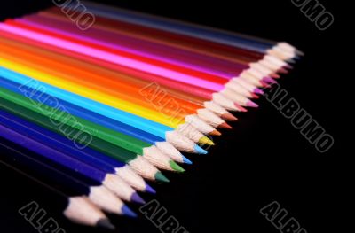 Colorful pencils isolated on black
