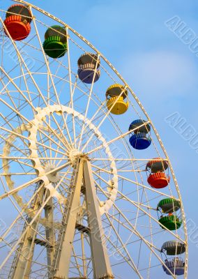 Big ferris wheel on cloudy sky