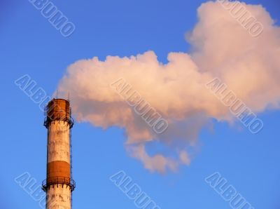 Smoking factory pipe closeup