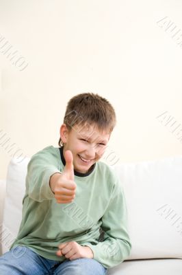 Smiling teenager show thumb up sign