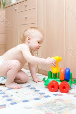 Baby play with toys in the room