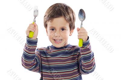 Child with a spoon and fork
