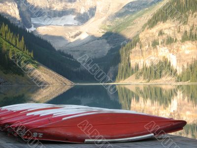 Canoes at the bottom of a mountain