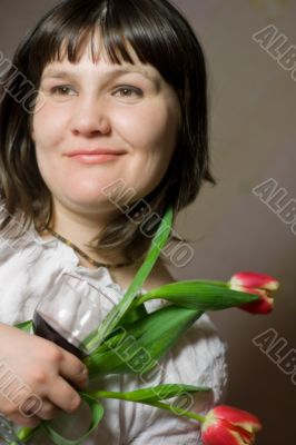 woman with tulips and glass of wine