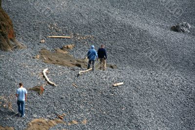 Family exploring rocky beach