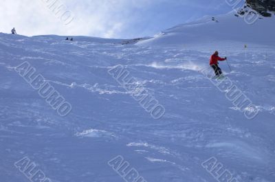 Red skier in powder snow