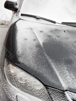 The black automobile in snow