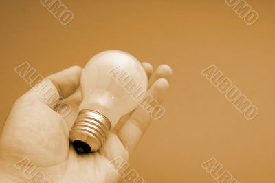 Background with lit lightbulb