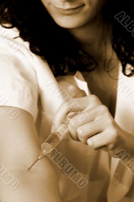 Portrait of a young doctor with syringa.