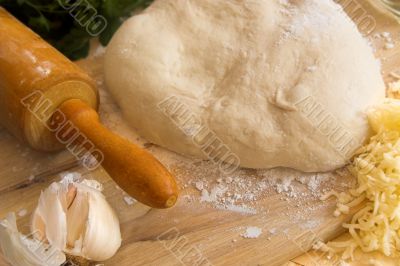 pizza dough and rolling pin