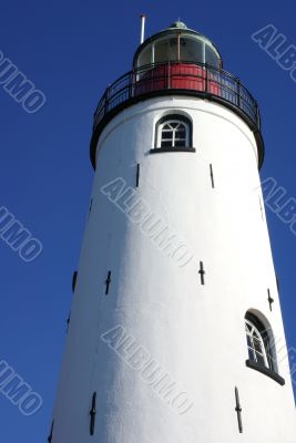 White lighthouse, blue sky.