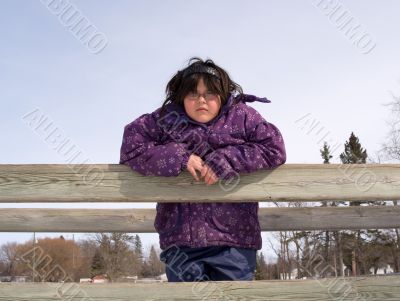 Girl Posing On A Wooden Bridge