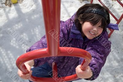 Girl Climbing Playground Equipment