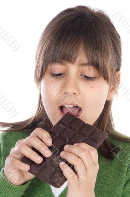 adorable girl eating chocolate