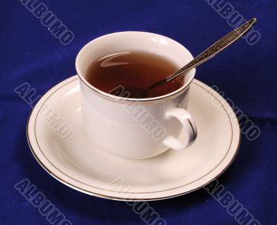 Cup of tea with teaspoon